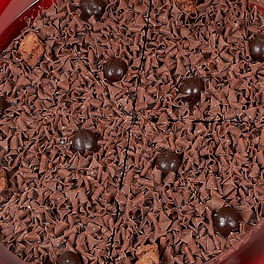 A close up of our Delightfully Dark Chocolate Pizza showing milk curls, dark chocolate riceballs and brownie biscuits